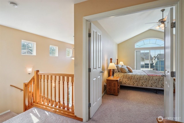 carpeted bedroom with lofted ceiling