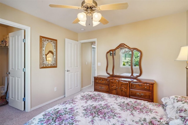 bedroom with baseboards, carpet flooring, and a ceiling fan