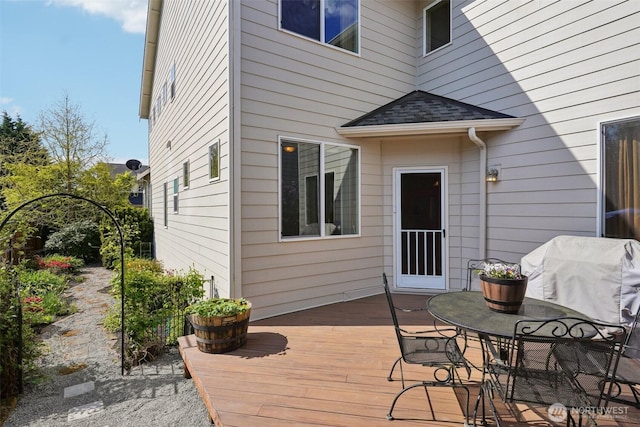 wooden deck featuring grilling area
