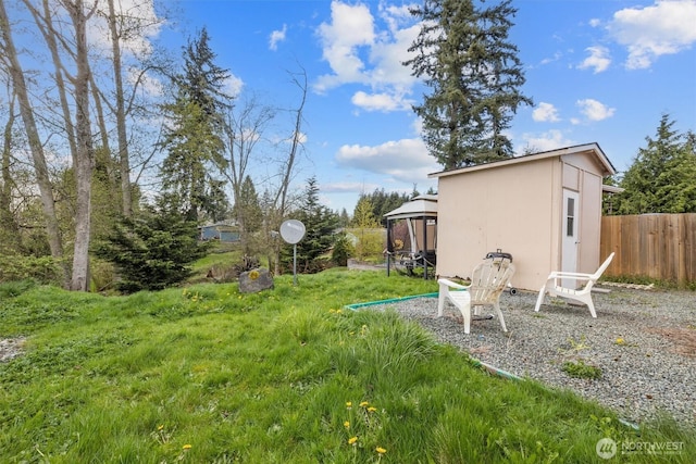view of yard featuring a gazebo and fence