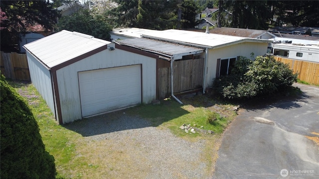 exterior space featuring fence and driveway