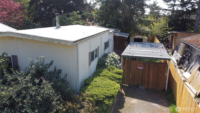 view of side of property featuring fence