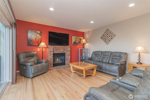 5801 51st Avenue Ct E, Tacoma, WA 98443 - living room featuring wood finished floors, a fireplace, and recessed lighting