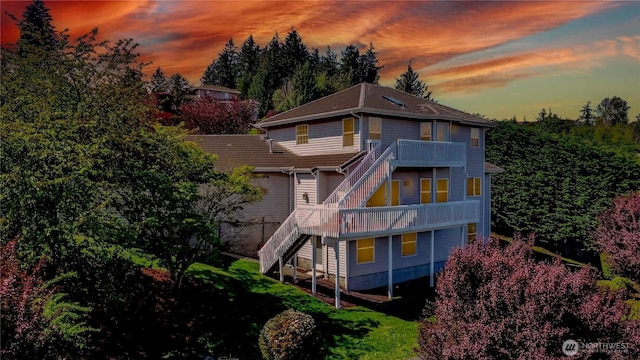 5801 51st Avenue Ct E, Tacoma, WA 98443 - back of house at dusk with stairs and a deck