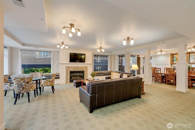 109 2nd St S Unit 523, Kirkland, WA 98033 - living area featuring visible vents, light carpet, and a tile fireplace