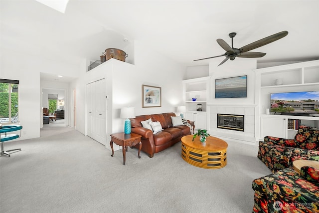 351 19th St NE Unit 10, East Wenatchee, WA 98802 - living room with a ceiling fan, built in shelves, carpet, and a fireplace