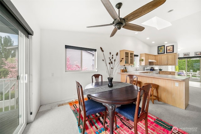351 19th St NE Unit 10, East Wenatchee, WA 98802 - dining room with recessed lighting, ceiling fan, vaulted ceiling with skylight, and light carpet