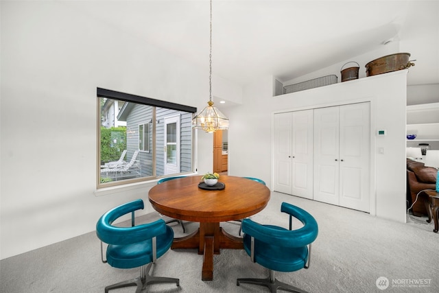 351 19th St NE Unit 10, East Wenatchee, WA 98802 - dining space with vaulted ceiling, a chandelier, and carpet