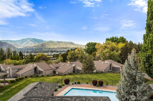 351 19th St NE Unit 10, East Wenatchee, WA 98802 - view of pool featuring a residential view, fence, a fenced in pool, a mountain view, and a yard