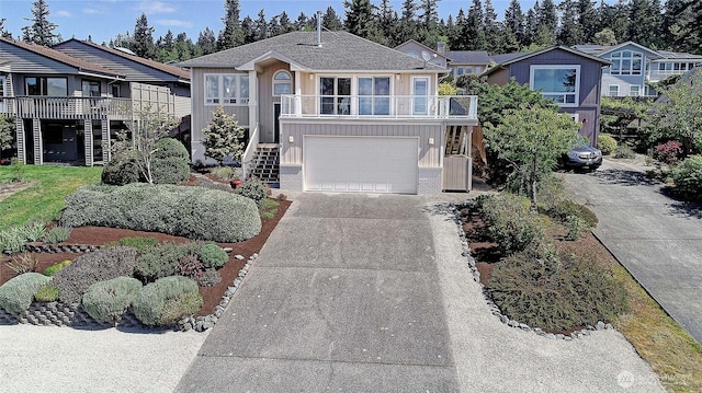 2279 Elger Park Rd, Camano Island, WA 98282 - coastal inspired home featuring stairs, driveway, an attached garage, and a balcony