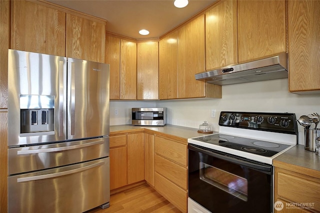 2279 Elger Park Rd, Camano Island, WA 98282 - kitchen featuring stainless steel appliances, extractor fan, light wood-style flooring, light countertops, and recessed lighting