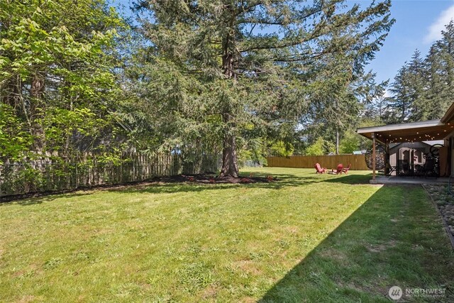 view of yard with a fenced backyard