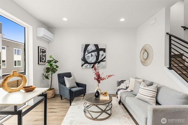 1124C 13th Ave, Seattle, WA 98122 - living area featuring a wall unit AC, light wood-style floors, recessed lighting, and baseboards