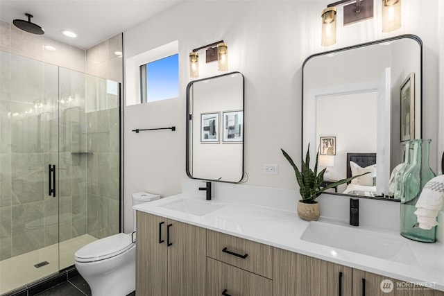 1124C 13th Ave, Seattle, WA 98122 - ensuite bathroom featuring a stall shower, double vanity, toilet, and tile patterned floors