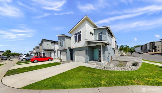 view of front facade with a garage, a front lawn, a residential view, and concrete driveway