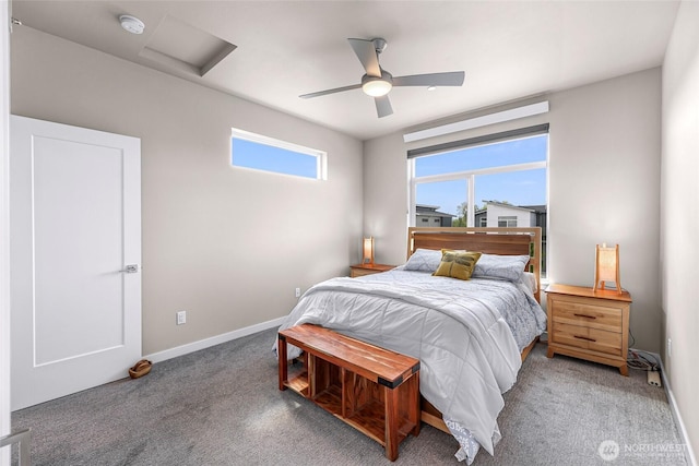 bedroom featuring carpet floors, baseboards, a ceiling fan, and attic access