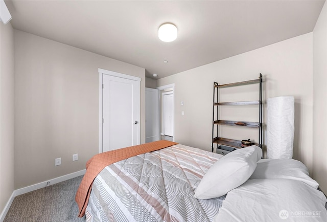 carpeted bedroom featuring baseboards