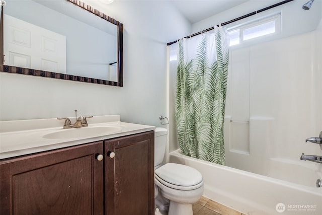 bathroom with vanity, tile patterned floors, shower / bath combo with shower curtain, and toilet