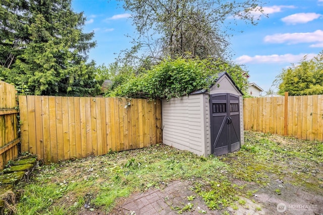 view of shed featuring a fenced backyard