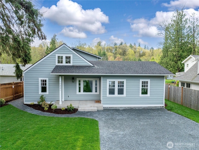 10841 NE 108th St, Kirkland, WA 98033 - view of front facade with roof with shingles, fence private yard, gravel driveway, and a front yard