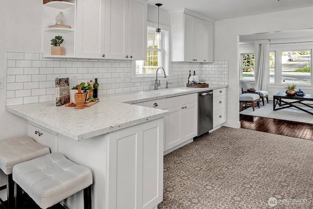 10841 NE 108th St, Kirkland, WA 98033 - kitchen featuring white cabinets, backsplash, light stone counters, and a sink