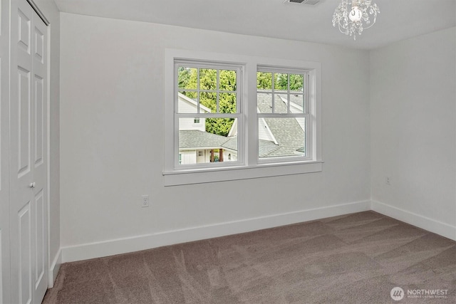 10841 NE 108th St, Kirkland, WA 98033 - carpeted spare room with baseboards, a notable chandelier, and visible vents