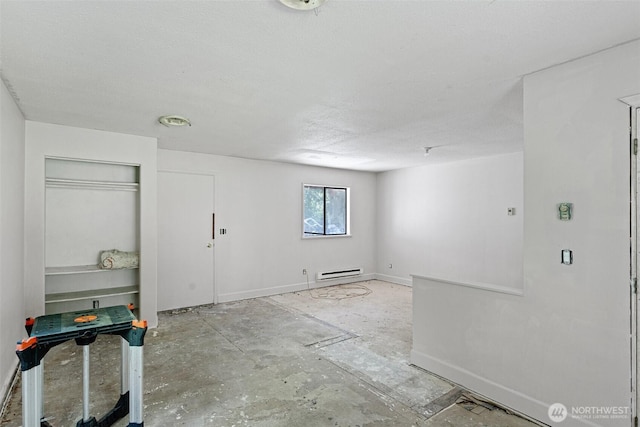 interior space featuring baseboards and baseboard heating