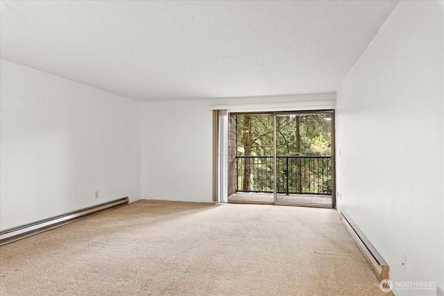 6702 139th Ave NE Unit 742, Redmond, WA 98052 - unfurnished room featuring carpet and a baseboard heating unit