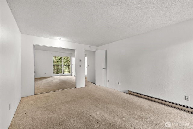 6702 139th Ave NE Unit 742, Redmond, WA 98052 - empty room featuring a textured ceiling, baseboard heating, and carpet