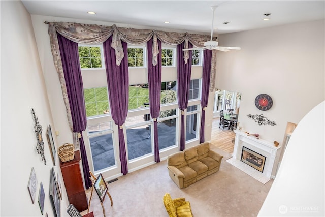 living area featuring a ceiling fan, recessed lighting, and visible vents