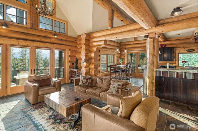living area with french doors, stone tile floors, log walls, and high vaulted ceiling