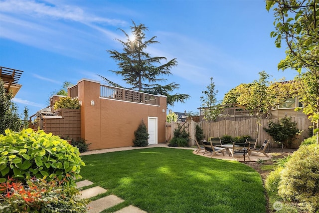 view of yard with fence and a patio area
