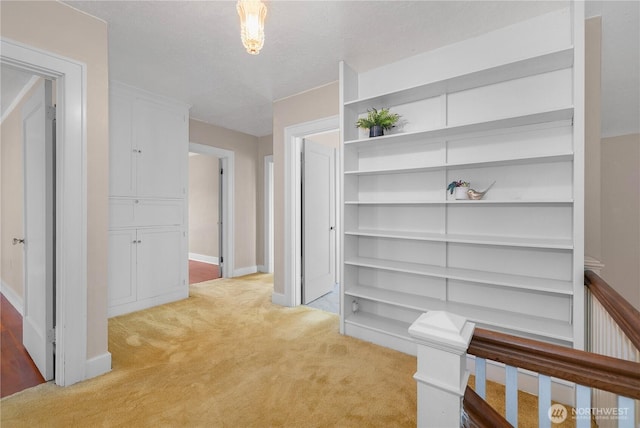 437 NW Pennsylvania Ave, Chehalis, WA 98532 - corridor featuring baseboards and light carpet