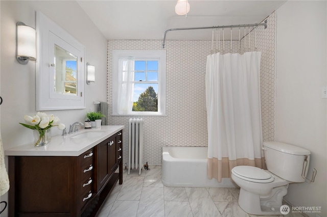 437 NW Pennsylvania Ave, Chehalis, WA 98532 - bathroom featuring shower / tub combo, vanity, toilet, marble finish floor, and radiator heating unit