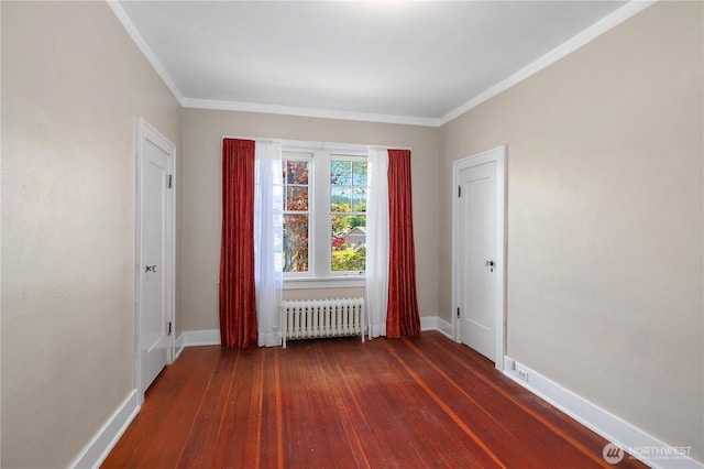437 NW Pennsylvania Ave, Chehalis, WA 98532 - empty room featuring baseboards, dark wood finished floors, and radiator heating unit
