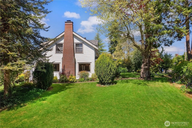437 NW Pennsylvania Ave, Chehalis, WA 98532 - back of property featuring a lawn and a chimney