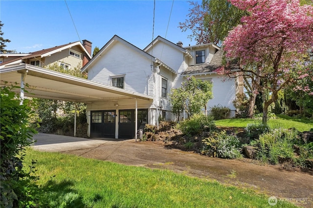 437 NW Pennsylvania Ave, Chehalis, WA 98532 - view of home's exterior featuring a carport and driveway