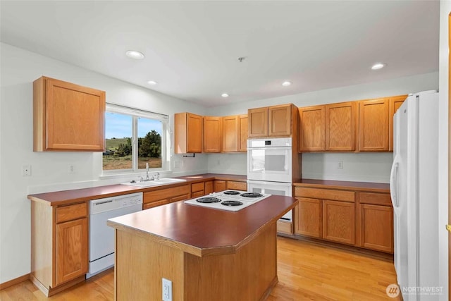 300 Range View Rd, Ellensburg, WA 98926 - kitchen with white appliances, a sink, light wood-style flooring, a kitchen island, and recessed lighting