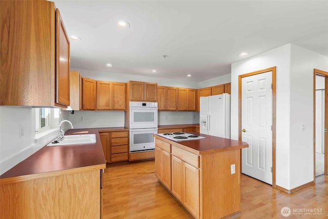 300 Range View Rd, Ellensburg, WA 98926 - kitchen featuring a sink, white appliances, recessed lighting, light wood-style floors, and a kitchen island