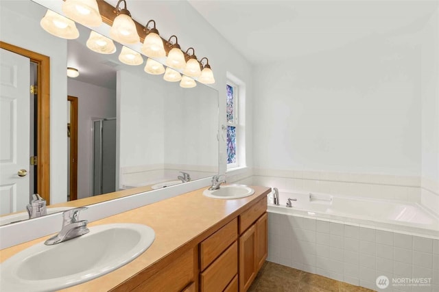 300 Range View Rd, Ellensburg, WA 98926 - bathroom featuring a garden tub, double vanity, tile patterned floors, and a stall shower