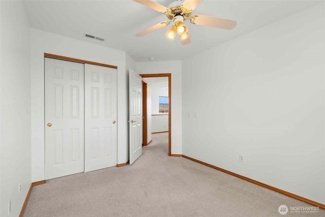 300 Range View Rd, Ellensburg, WA 98926 - unfurnished bedroom featuring baseboards, light colored carpet, a closet, and a ceiling fan