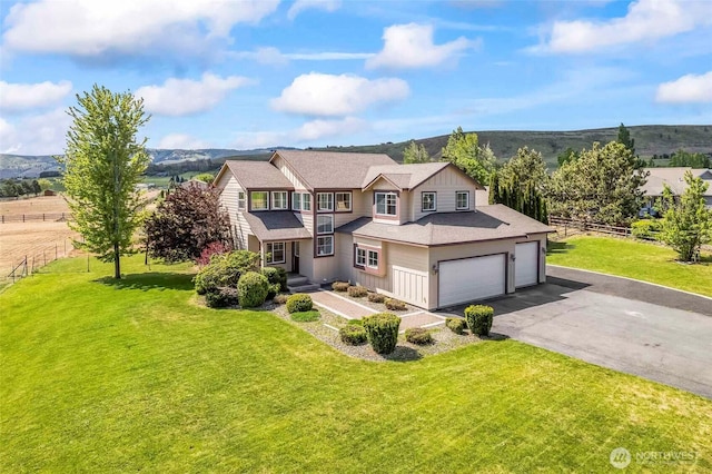 300 Range View Rd, Ellensburg, WA 98926 - view of front of house featuring asphalt driveway, roof with shingles, a garage, and a mountain view
