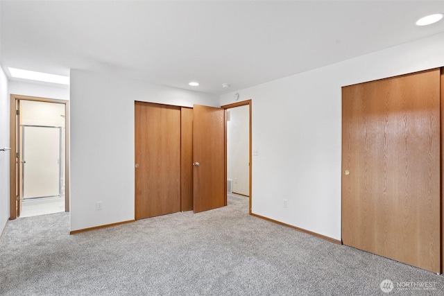unfurnished bedroom featuring carpet floors, baseboards, and recessed lighting