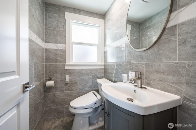 3012 N 30th St, Tacoma, WA 98407 - half bathroom featuring tile walls, vanity, and toilet