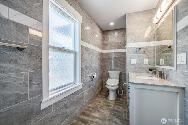 3012 N 30th St, Tacoma, WA 98407 - bathroom with tile walls, tile patterned floors, vanity, and toilet