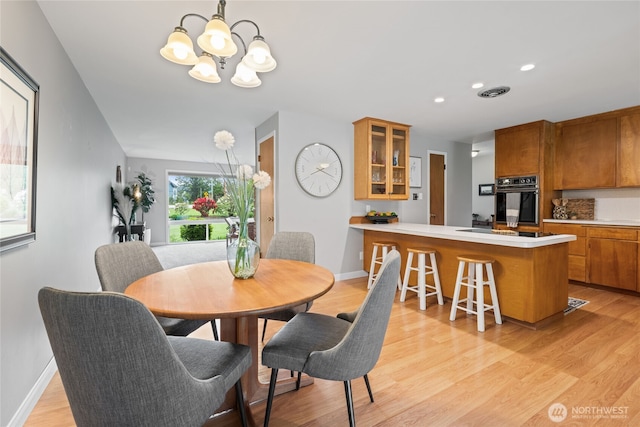 13203 436th Ave SE, North Bend, WA 98045 - dining room with light wood-style floors, visible vents, baseboards, an inviting chandelier, and recessed lighting
