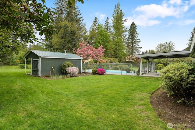 13203 436th Ave SE, North Bend, WA 98045 - view of yard with fence, an outdoor structure, and a fenced in pool