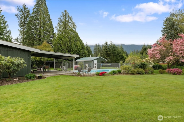 13203 436th Ave SE, North Bend, WA 98045 - view of yard with a fenced in pool, a patio area, and fence