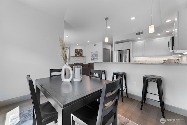 4961 Main St Unit 612, Tacoma, WA 98407 - dining space featuring light wood-style flooring, recessed lighting, and baseboards