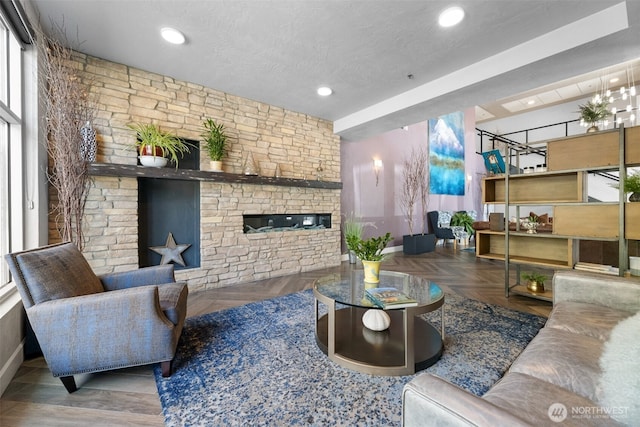 4961 Main St Unit 612, Tacoma, WA 98407 - living area with baseboards, recessed lighting, a fireplace, and a textured ceiling
